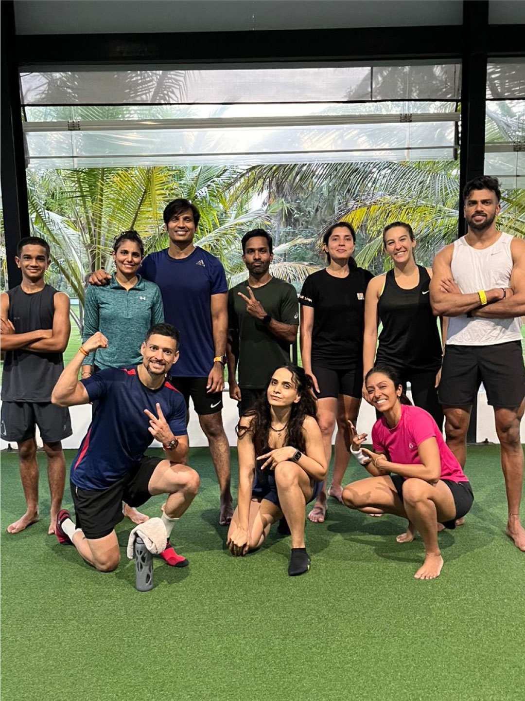 Group photo of Sol Fitness guests on training lawn