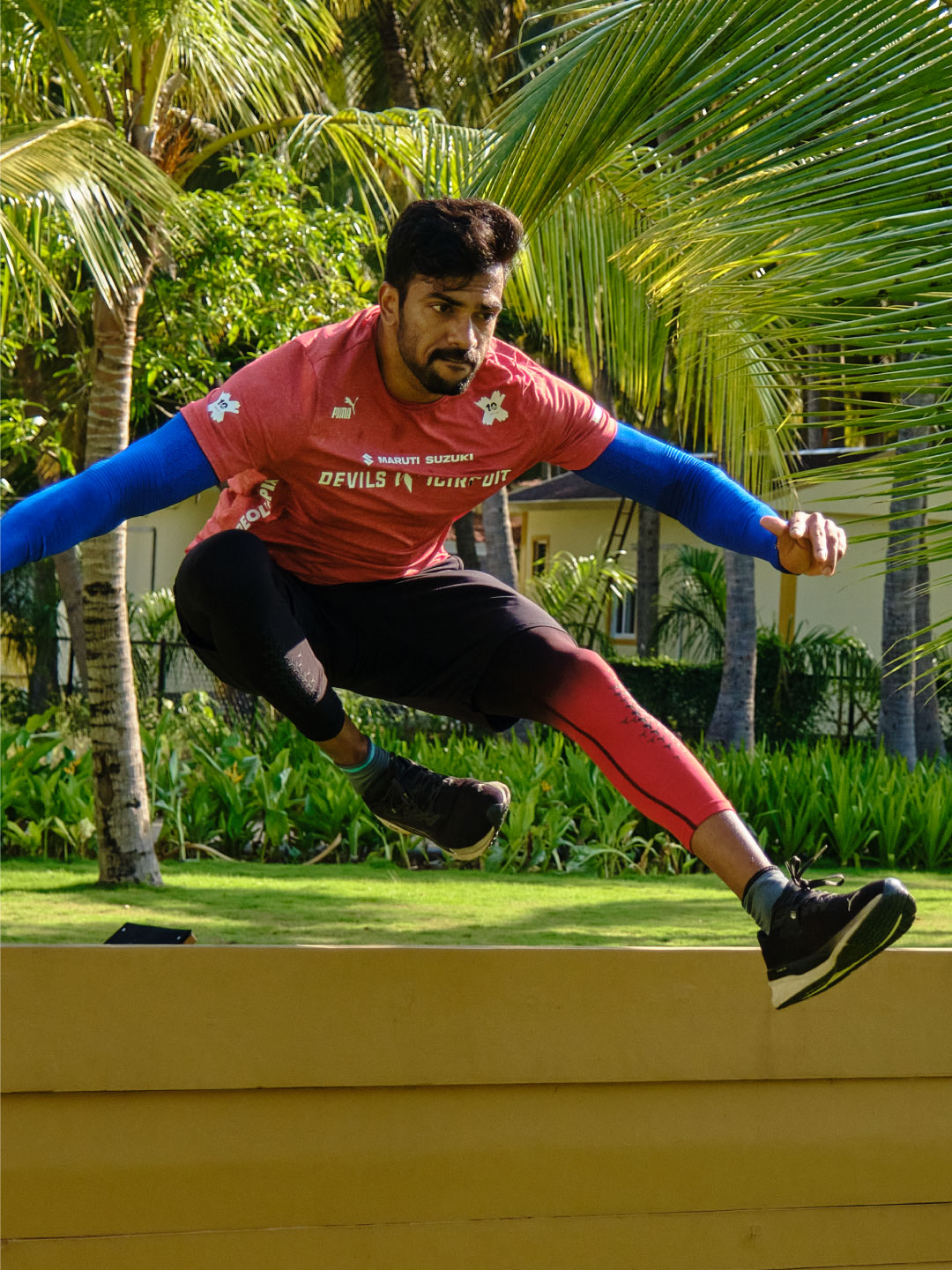 Wall jump over obstacle during HYROX race at Sol Fitness Resorts
