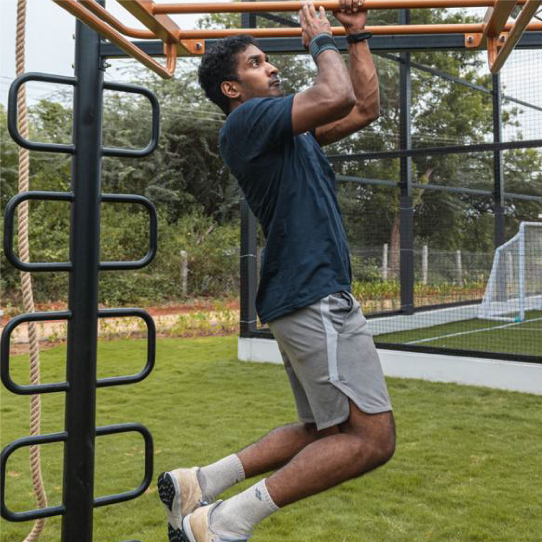 Pull-up training on monkey bars at Sol Fitness bootcamp