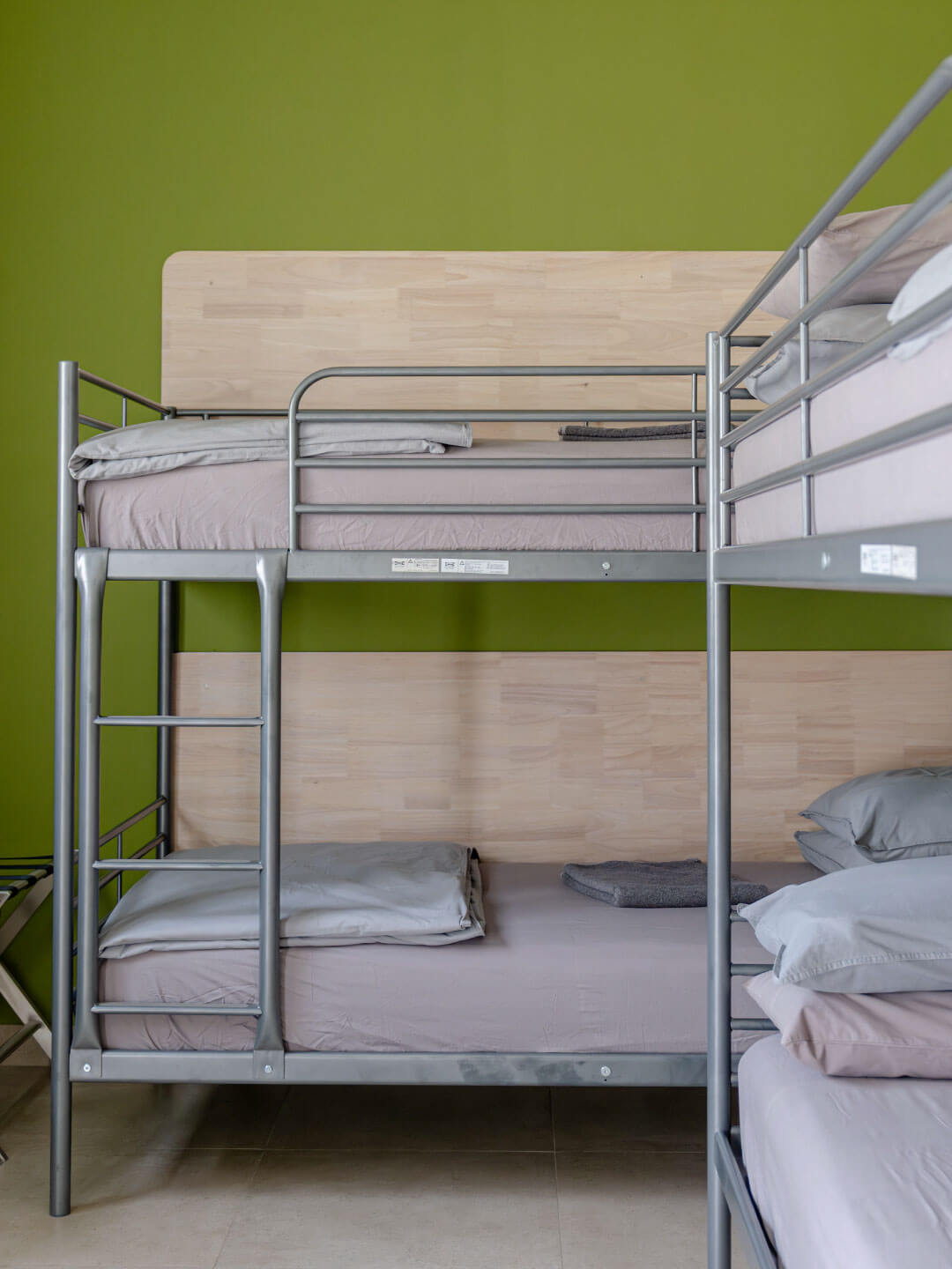 Neatly arranged dorm-style bunk room at Sol Fitness Retreat