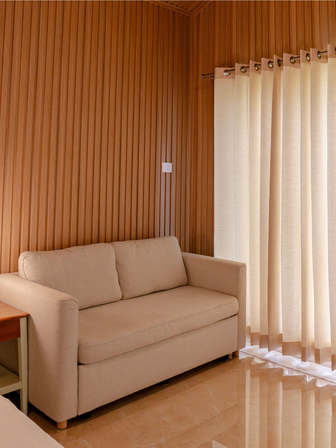 Cozy seating area inside Sol Fitness Resorts luxury rooms